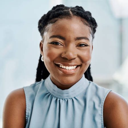 Confident black businesswoman working in an office alone